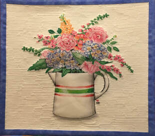 Picture flowers in pitcher with custom quilting