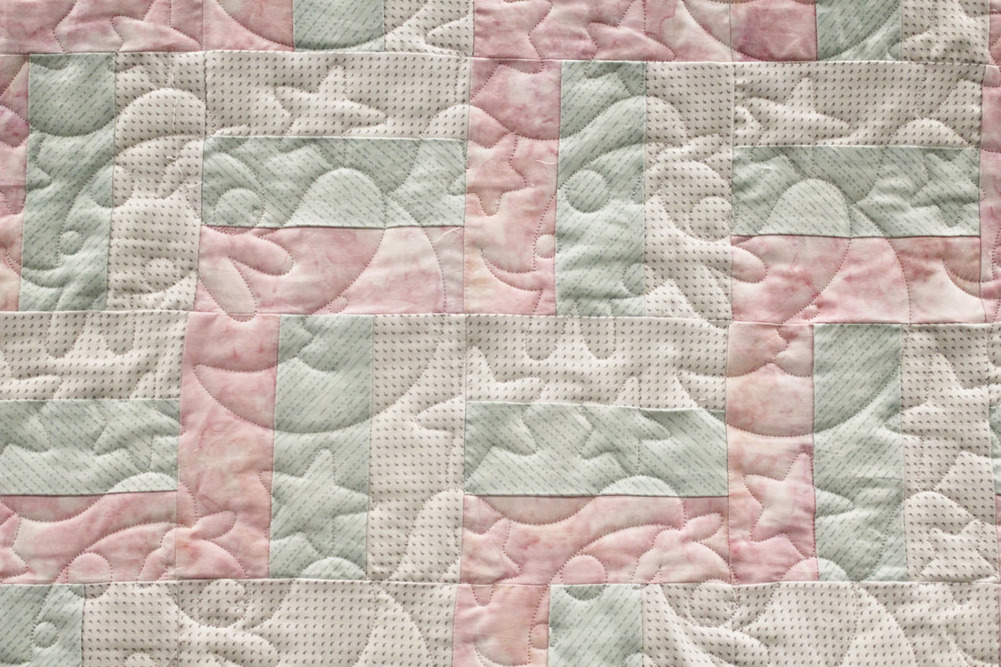 Picture Over The Moon Pantograph on a baby quilt