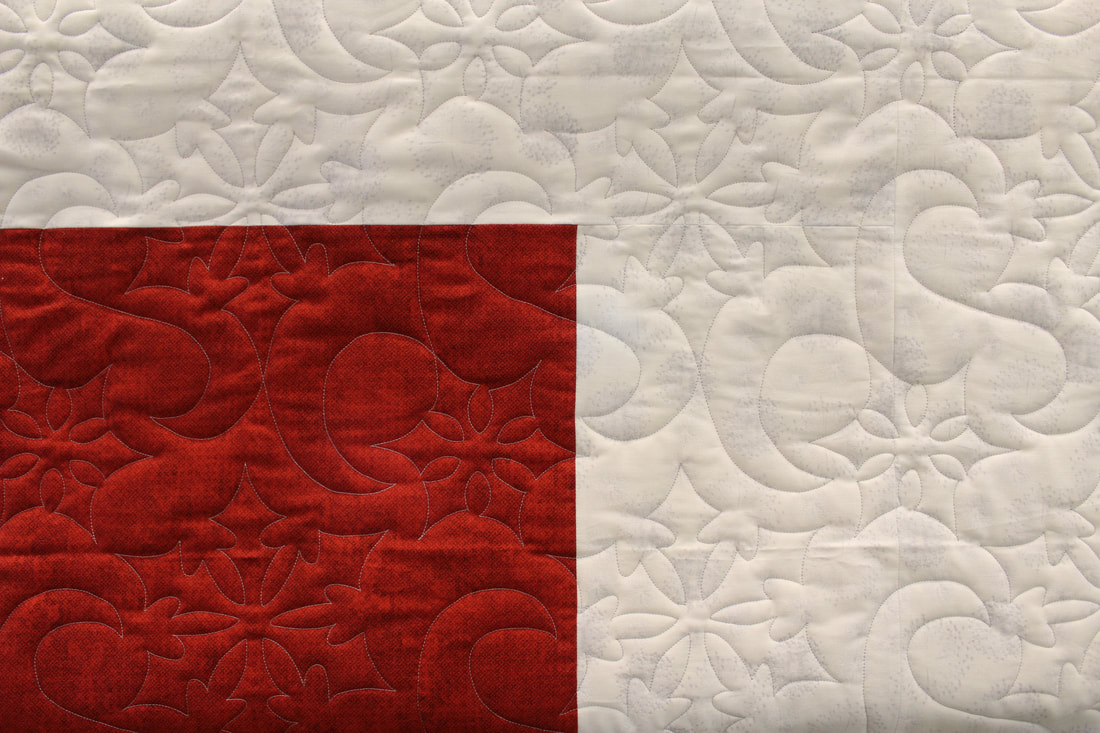 Picture Snow Winds Pantograph on Red and White Quilt