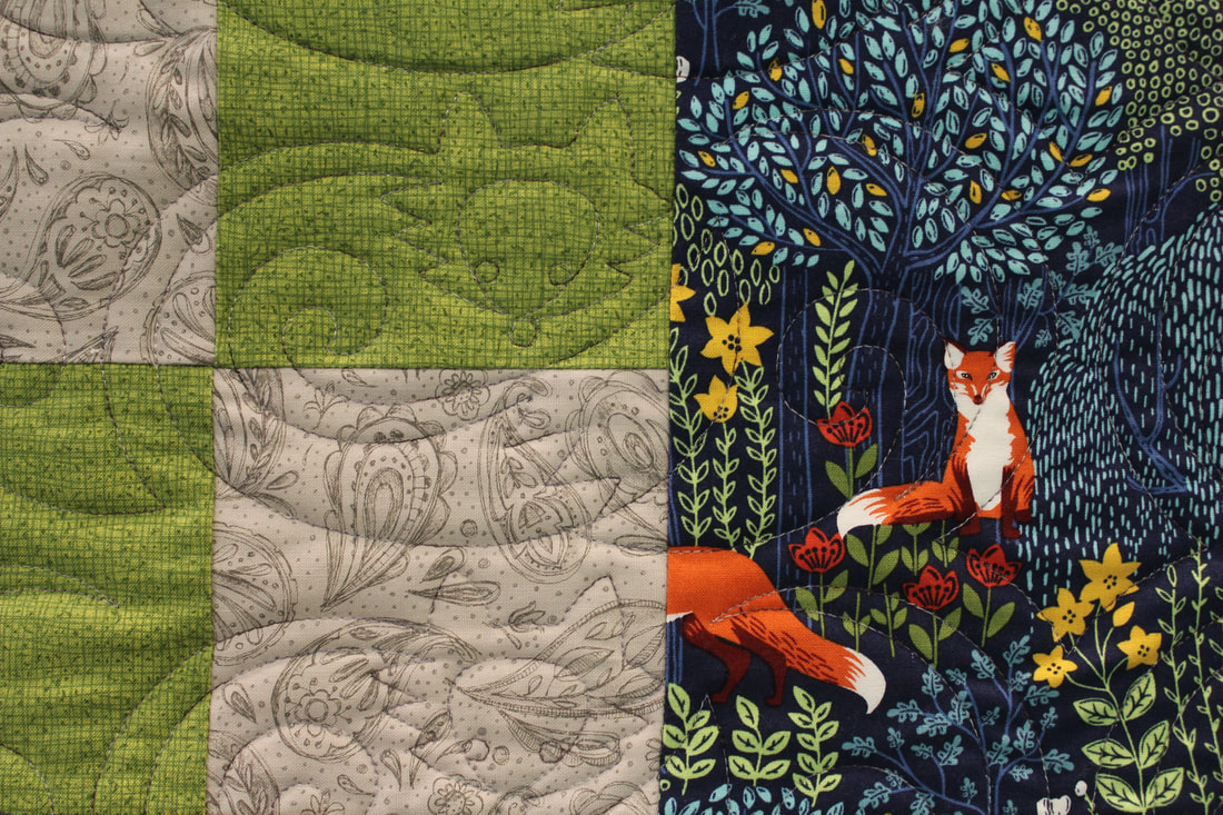 Picture Foxtrot quilting on a fox theme quilt
